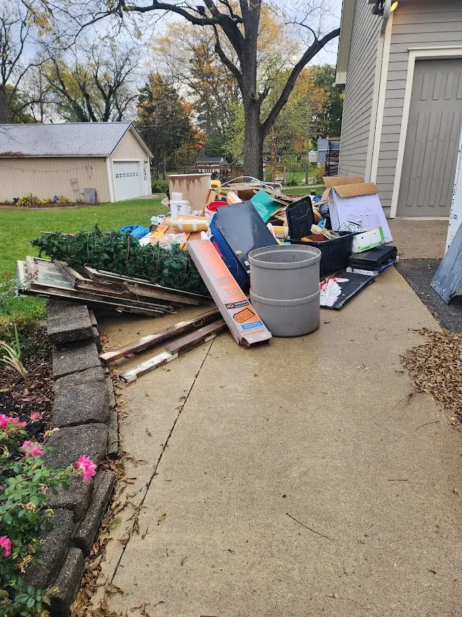 Dumpster being loaded with debris for Residential Dumpster Rental in Algonquin